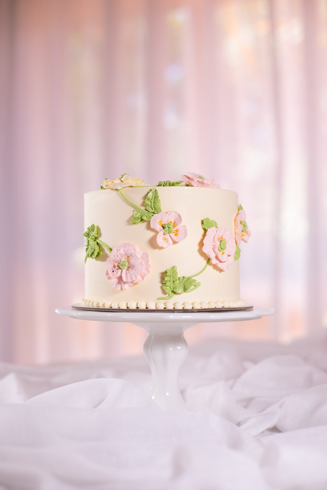 Buttercream cake with piped buttercream flowers and leaves - Sweet Passion Cakes Aus